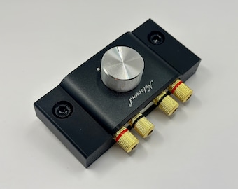 May include: A black audio amplifier with a silver knob and gold-plated speaker terminals. The amplifier is labeled "Nobsound".