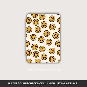 May include: A rectangular phone case featuring a repeating pattern of yellow smiley faces on a cream background. The case has rounded corners and the text "LEFTONREADCASES" is printed near the bottom. The bottom of the image has the text "PLEASE DOUBLE CHECK MODEL # WITH LISTING & DEVICE".