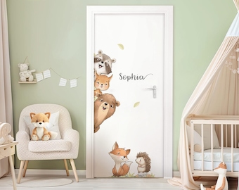 May include: A white door with a personalized name, "Sophia", written in cursive. The door is decorated with a whimsical scene of woodland animals, including a raccoon, a fox, a squirrel, a bear, and a hedgehog.