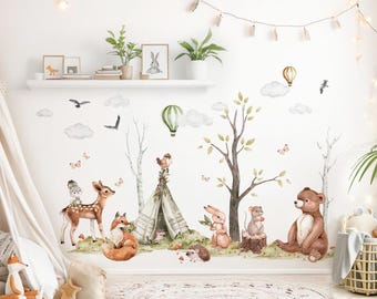 May include: Watercolor wall decals featuring a woodland theme with a deer, fox, bear, rabbit, and other forest animals. Includes trees, clouds, butterflies, and a teepee. The color palette is soft and natural, with shades of brown, green, and beige.