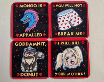 May include: Four square coasters with black backgrounds, red borders, and red skull icons. The top left shows a blue dinosaur with the text MONGO IS APPALLED. The top right shows heart-patterned boxers with YOU WILL NOT BREAK ME. The bottom left shows a cat with the text GODDAMNIT, DONUT. The bottom right shows a blonde character with I WILL KILL YOUR MOTHER.