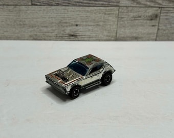 Hot Wheels '1974 Gremlin Grinder Coche Plateado (Metal fundido a presión, fabricado en Hong Kong)