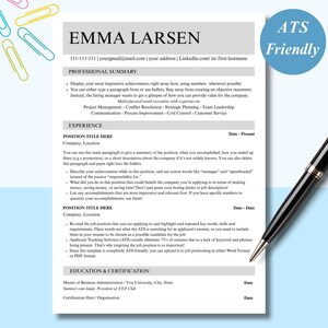 May include: A resume template with the name "EMMA LARSEN" at the top. The document includes sections for professional summary, experience, education, and certification. A black pen rests on the right side of the document, and colourful paperclips are scattered at the top.
