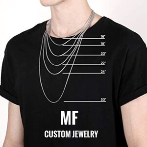 May include: A black t-shirt with a white outline of different chain lengths, ranging from 16 to 30 inches. The text "MF CUSTOM JEWELRY" is printed below the chain outlines.