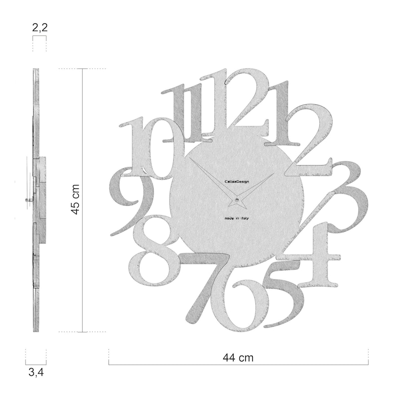 May include: A modern wall clock with a circular face and large, stylized numerals. The clock is 45 cm tall and 44 cm wide. The clock's thickness is 3.4 cm. The clock is made in Italy.