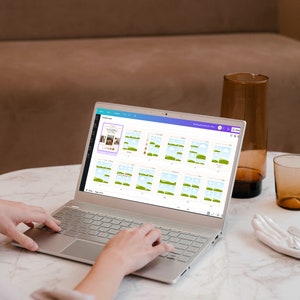 May include: A person using a laptop computer to design a social media post. The laptop screen shows a design template with a blue sky, green grass, and white clouds. The design template is for a social media post about "Sleeping Beauty".
