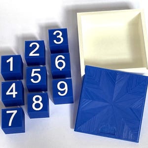 Corsi Cubes with matching box option. 9 blue plastic cubes with blank numbers 1-9, Corsi block tapping test.