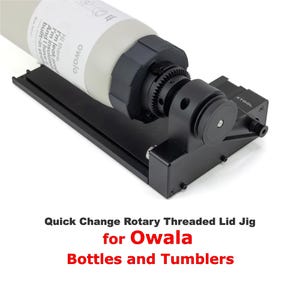 May include: A black quick change rotary threaded lid jig for Owala bottles and tumblers. The jig is made of metal and has a black handle. The jig is designed to help you easily and quickly change lids on your Owala bottles and tumblers.
