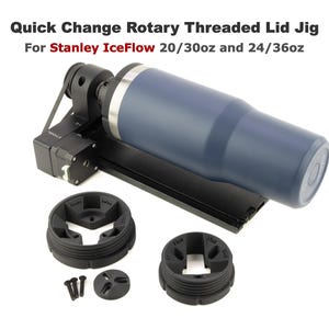 May include: A black rotary threaded lid jig for Stanley IceFlow 20/30oz and 24/36oz tumblers. The jig has a black belt and a blue tumbler in the image. There are two black plastic rings with a three-pronged design.