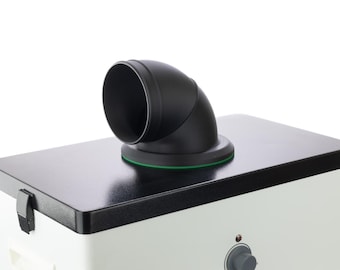 May include: A white and black air purifier with a black plastic exhaust pipe. The exhaust pipe is angled upwards and has a black plastic ring around it.