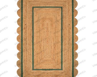 May include: Rectangular jute rug with a scalloped edge. The rug has a natural tan color with a dark green border. The center of the rug has a woven design. The rug is a decorative floor covering.