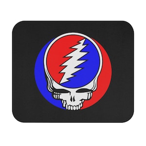 May include: A black mouse pad with a colorful graphic of a skull with a lightning bolt design. The skull is red, white, and blue.