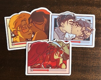 May include: Three stickers depicting couples kissing, each within a rectangular frame. The frames include a play button and a red progress bar. The illustrations showcase diverse skin tones and hair colours, creating a varied set.