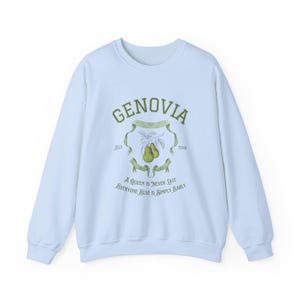 May include: Light blue sweatshirt with a green graphic print of a crest with the text "GENOVIA Est. 2001" and the text "A Queen is Never Late Everyone Else is Simply Early".