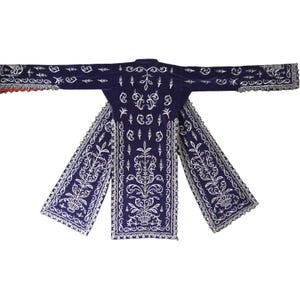 May include: A deep purple velvet coat featuring intricate silver embroidery in floral and vine patterns. The garment has long, wide sleeves and two long, rectangular panels extending from the waist, all finished with silver lace trim.