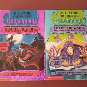 May include: Two Goosebumps books with a purple and blue cover. The book on the left has a werewolf on the cover and the text "Night in Werewolf Woods #5". The book on the right has a boy covered in purple peanut butter on the cover and the text "Beware of the Purple Peanut Butter #6".