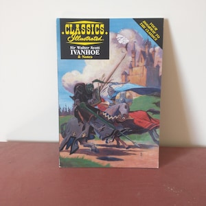 May include: A book cover with an illustration of two knights on horseback, one in green armor and the other in blue armor, riding towards a castle in the background. The book title is "CLASSICS Illustrated" and the subtitle is "Sir Walter Scott IVANHOE & Notes".