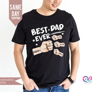 May include: Black t-shirt with the text "Best Dad *Ever" and a graphic of fists with the names "Daddy", "Oliver", "Alica", and "Smith" written on them.