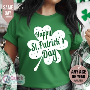 May include: A green t-shirt featuring a white shamrock with the text "Happy St. Patrick's Day." The shirt has short sleeves and is made of a soft material. A festive item for St. Patrick's Day.
