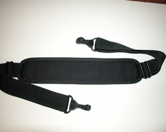 Adjustable Padded Shoulder Strap  1-1/2" wide  black webbing strap  34.5" up to 56" long  Made In USA