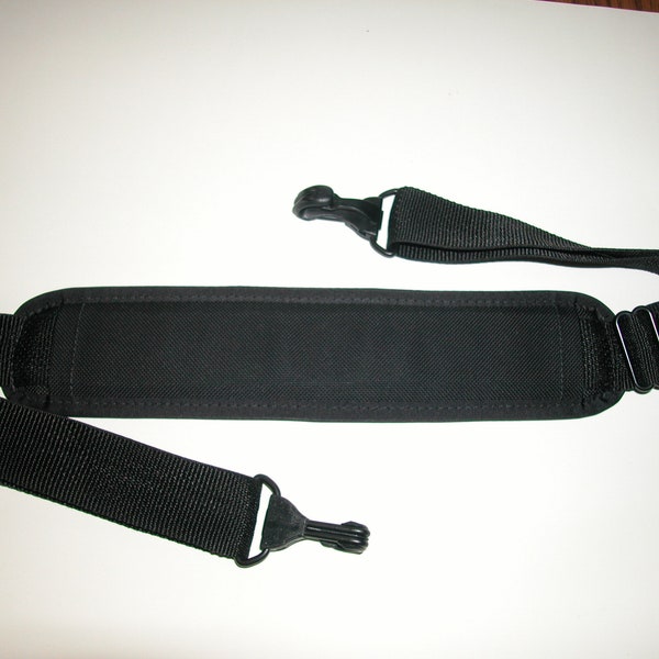 Adjustable Padded Shoulder Strap  1-1/2" wide  black webbing strap  34.5" up to 56" long  Made In USA