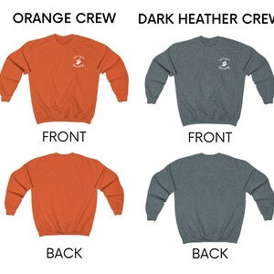 May include: Two crew neck sweatshirts, one orange and one dark heather grey, with a white ghost graphic and the text "Let's get spooky" on the front. The back of the sweatshirts are plain.