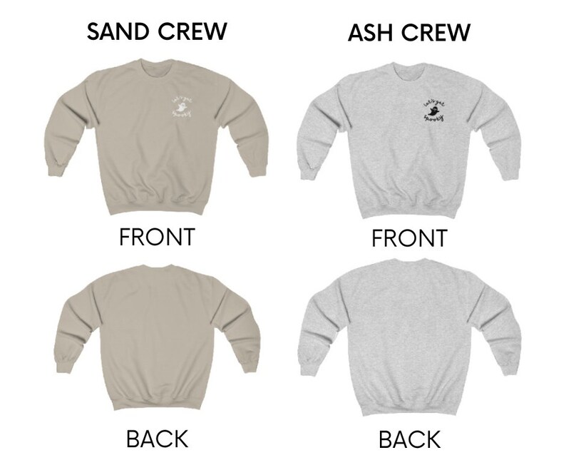 May include: Two crewneck sweatshirts, one in sand and one in ash grey, with a small graphic of a ghost on the front. The text "Cultured Spooky" is printed below the ghost. The sweatshirts are shown from the front and back.