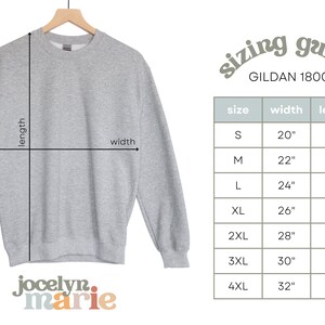 May include: A gray sweatshirt with a sizing guide for Gildan 1800 sweatshirts. The chart shows the width and length in inches for sizes S through 4XL.