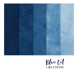 May include: Five vertical fabric swatches arranged in a gradient from dark navy blue to light sky blue, each featuring a subtle, crinkled, tie-dye texture. Below the fabric, the text Blue Cat CREATIONS is printed in a dark blue script and sans-serif font.