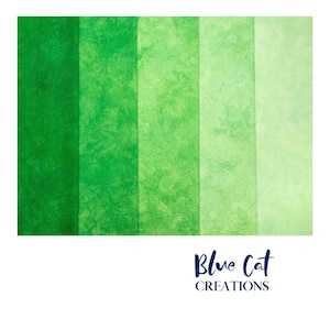 May include: Five vertical panels of fabric displaying a gradient of green shades, ranging from a deep forest green on the left to a pale mint green on the right. Each panel features a mottled, textured pattern. The text Blue Cat CREATIONS appears below.