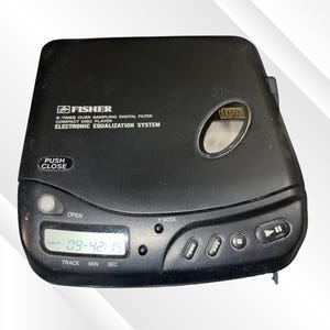 May include: A black Fisher portable compact disc player featuring an electronic equalization system, an 8-times oversampling digital filter, a digital LCD display showing 09-42-15, a push-to-close lid mechanism, and playback control buttons.