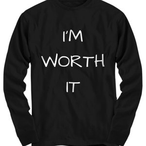 May include: Black long-sleeve shirt with white text that reads "I'M WORTH IT".