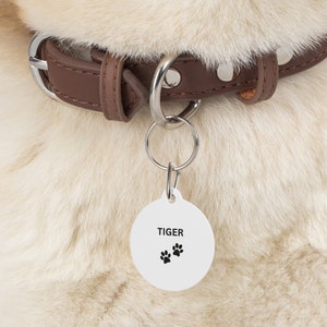 Pet Tags For The Extended Members Of The Family. Cat and Dog Tags For Added Security. White Coated Solid Metal Pet Tags.