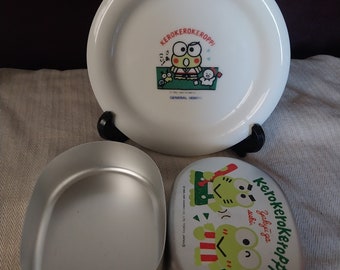Four: Three 90s Kerokerokeroppi Sanrio Plates + One Tin; New