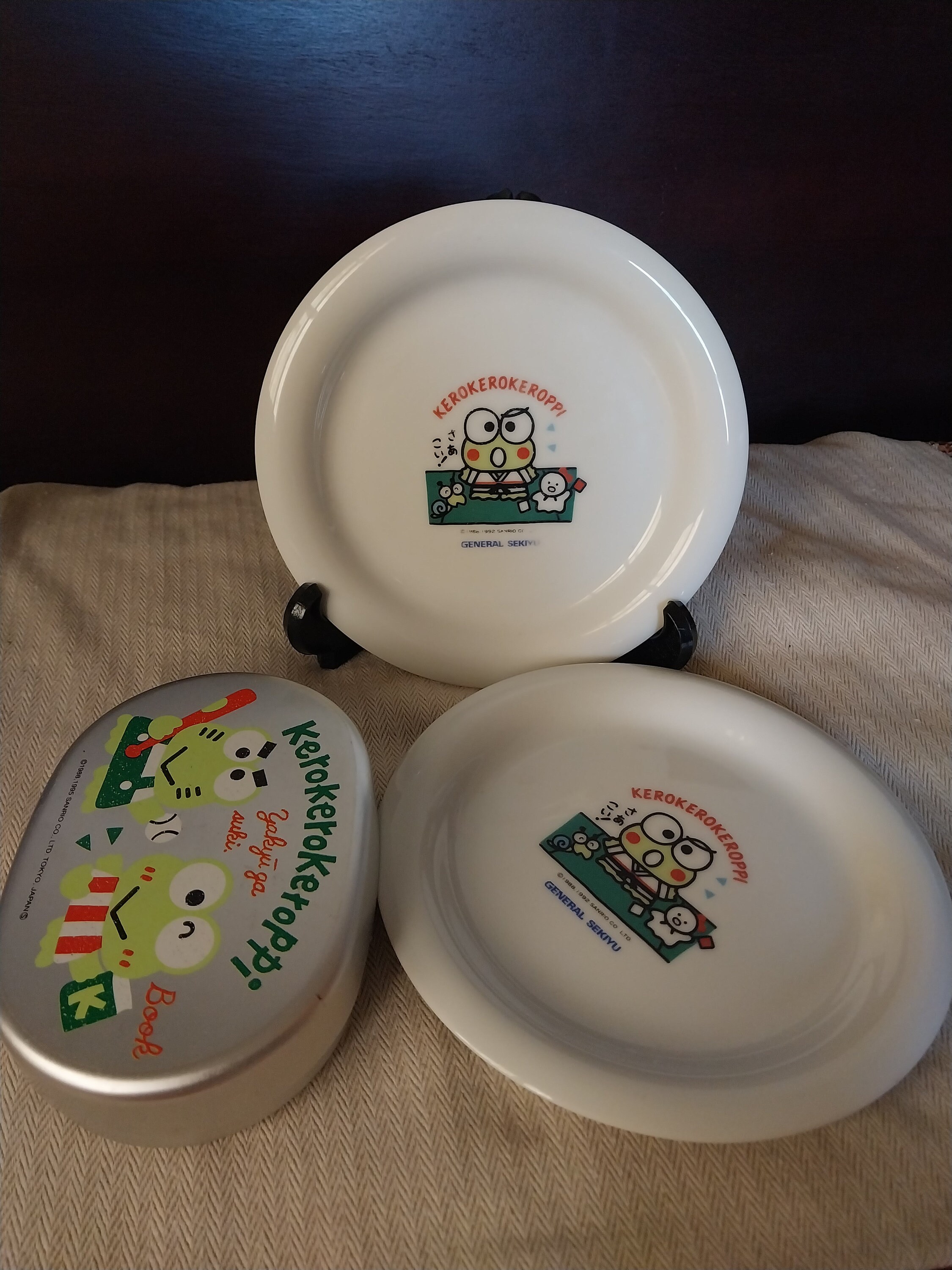 Four: Three 90s Kerokerokeroppi Sanrio Plates + One Tin; New