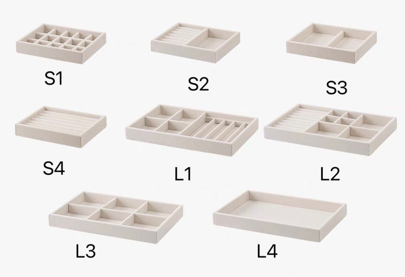 May include: A collection of eight beige velvet-lined jewelry organizer trays with various internal compartment configurations, labeled S1 through S4 and L1 through L4, designed for sorting small items like rings, earrings, and necklaces.