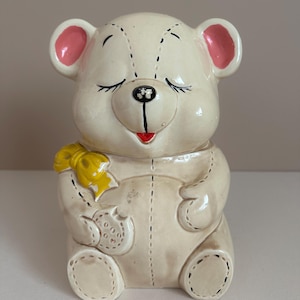1950s stuffed teddy bear cookie jar with yellow bow and visible stitching