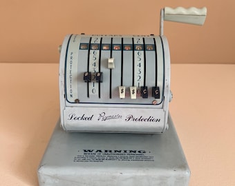 Máquina registradora y emisora de cheques Paymaster serie X-550 de los años 60 en color azul petirrojo