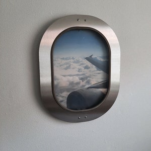 Original Airbus A340 window in stainless steel frame oval picture frame picture airplane photo