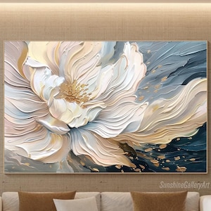 May include: Abstract painting of a large white flower with gold accents on a blue background. The flower is painted in a 3D style, with layers of petals overlapping each other.