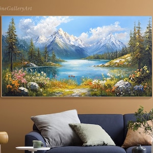 May include: A painting depicting a mountain lake scene with snow-capped mountains in the background, a blue lake in the foreground, and green trees and flowers along the shore.