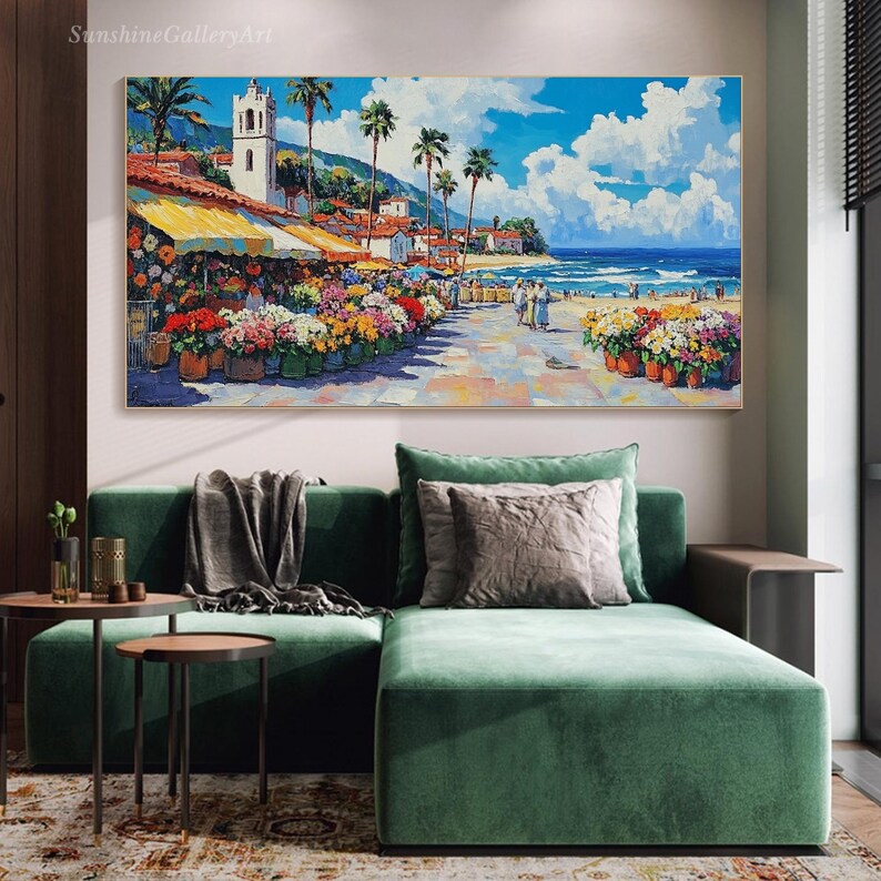 May include: A colorful painting of a seaside town with a white church, palm trees, and a flower market. The painting is set against a blue sky with white clouds and a turquoise ocean.