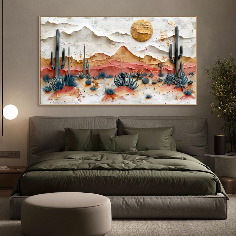 May include: A desert landscape painting with a textured, 3D effect. The painting features a golden sun, mountains, cacti, and desert plants in shades of brown, red, and green.