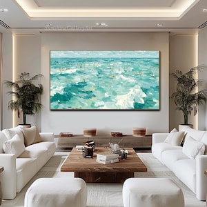 May include: Large rectangular painting depicting a turquoise ocean scene with numerous figures surfing or swimming. The artwork uses broad brushstrokes to create waves and a sense of movement. The sky is a pale blue, and the painting is framed in gold.