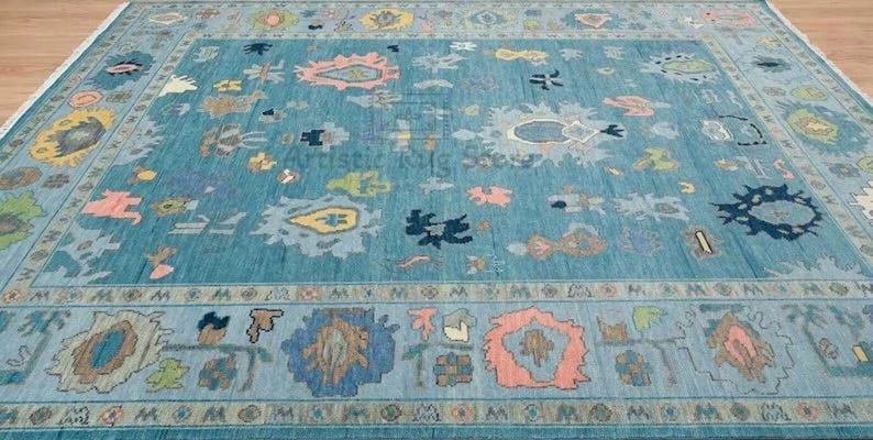 a large blue rug with many different designs on it