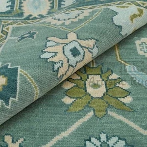 a close up of a blue and green rug