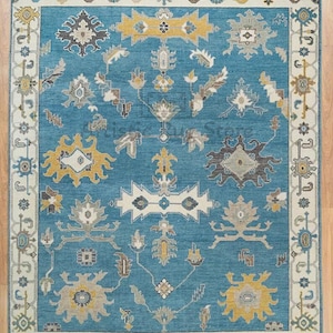 Hand-Knotted Wool Oushak Rug: Faded Blue, White-Beige Border, Yellow Accents