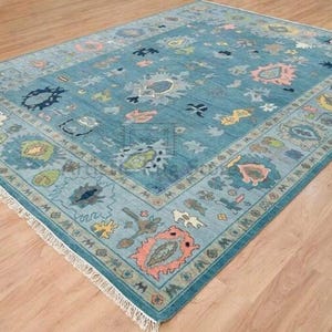 a blue area rug with various designs on it