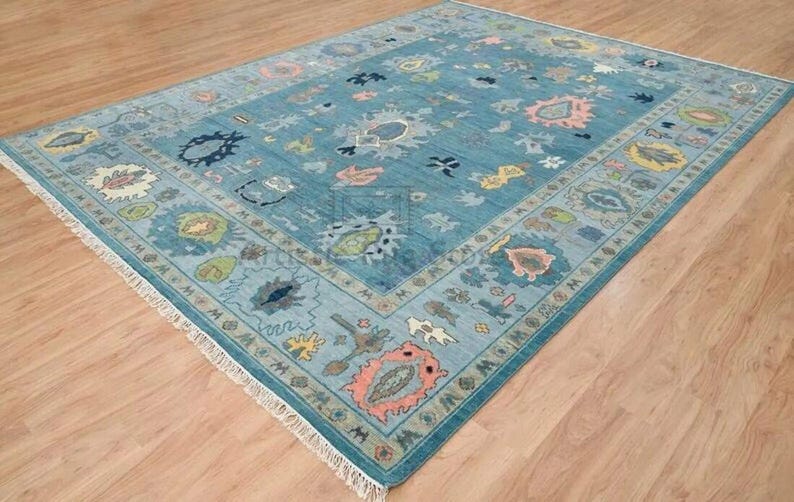 a blue area rug with various designs on it