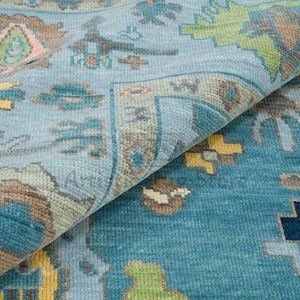 a close up of a rug with a blue background